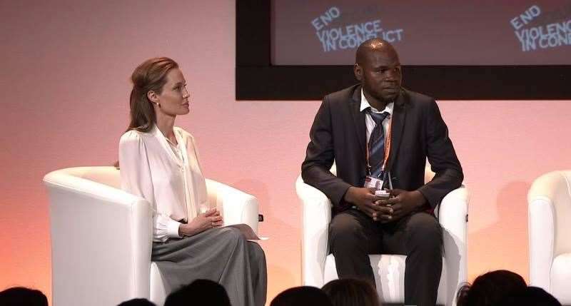 Kolbassia Haoussou with Angelina Jolie at the Global Summit to End Sexual Violence in Conflict in 2014 (Freedom From Torture/PA)