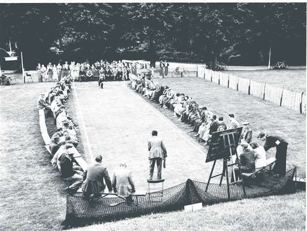 The final of the Canterbury bat and trap Festival Cup tournament in 1954 was held in Dane John Gardens, Canterbury. British Legion (who won the trophy) bat against the Post Office Telephones