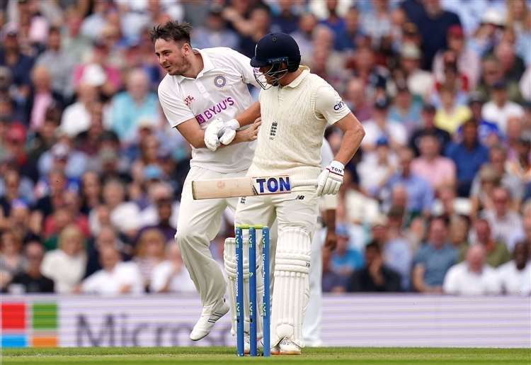 A man collides with England batsman Jonny Bairstow Photo:Adam Davy/PA
