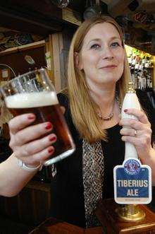 Haley Wakeman with a pint of Tiberius ale at The Phoenix Tavern in Faversham.