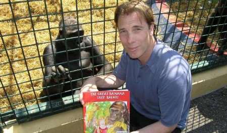Story time for mother gorilla Bamilla as Damian Aspinall reads from one of the new books