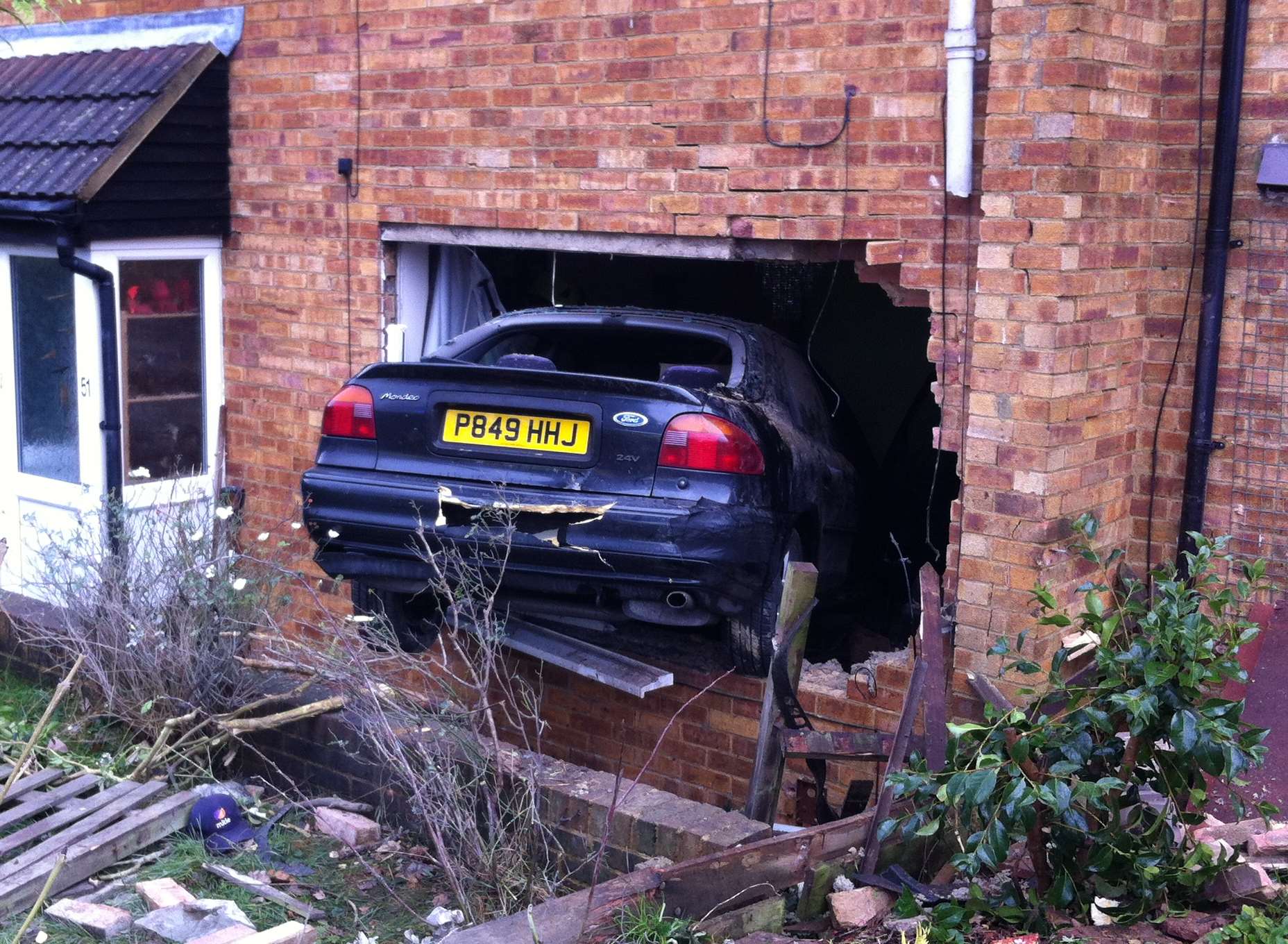 A car has crashed into the side of a house in Silverweed Road, Weedswood