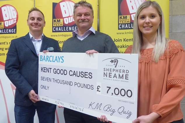 Jason Raggatt of Barclays bank and Mike Startup and Marisa Durling of Wilkins Kennedy announce the figure for amount raised at KM Big Charity Quiz.