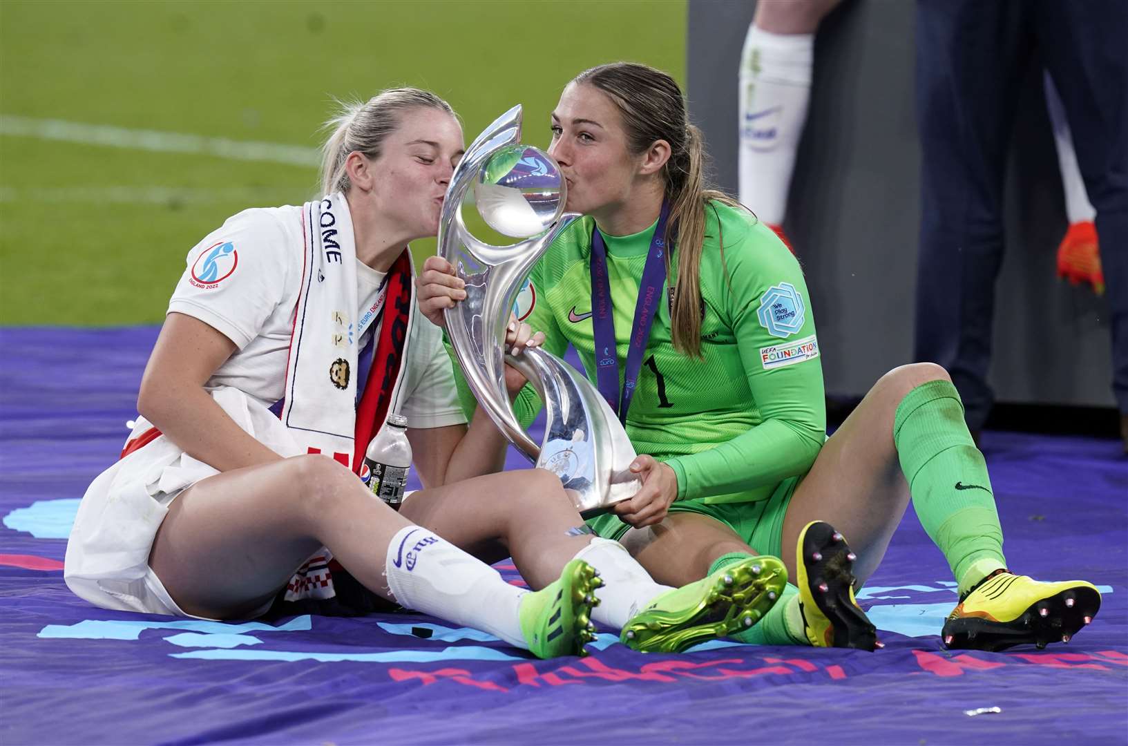 Alessia Russo, left, and goalkeeper Mary Earps celebrate with the trophy following victory over Germany in the record-breaking Wembley final. Picture: PA Wire