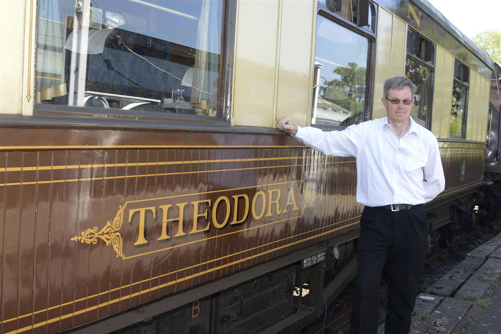 Kent and East Sussex Railway commercial manager Andre Freeman standing next to Theodora. Picture: Paul Amos