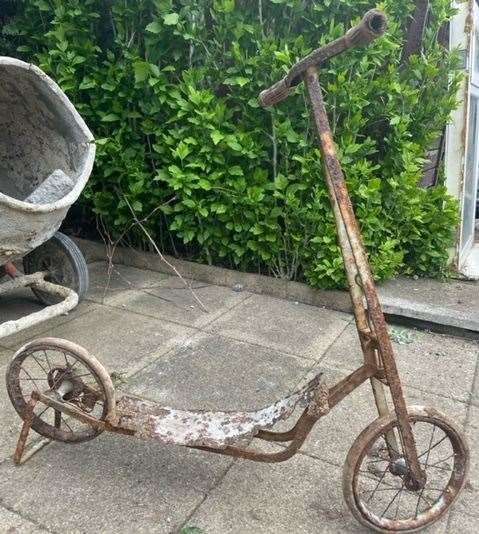 Rusty child's scooter discovered buried
