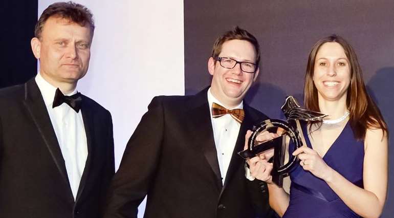 Alisdair and Kathryn Buchanan receive their National Optician Award for Technology Practice of the Year from actor Hugh Dennis, left