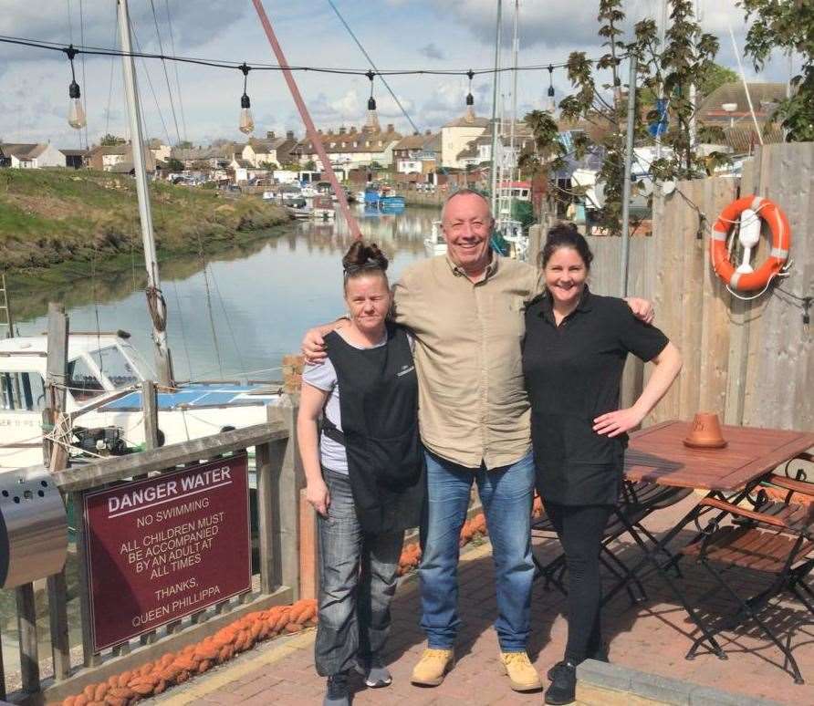 Owner Danny Pain, centre, with staff from the Queen Phillippa in Queenborough