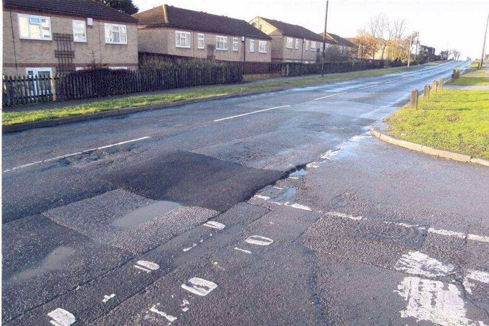 Patched up potholes in The Broadway, Minster