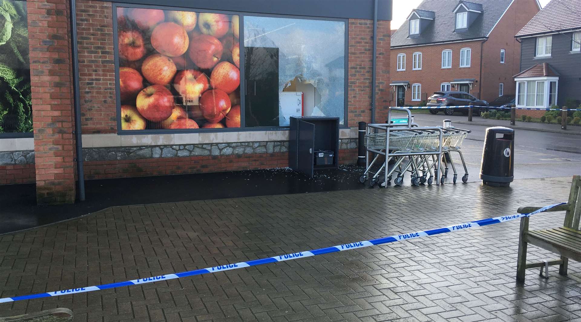 Smashed windows can be seen at one side of the store