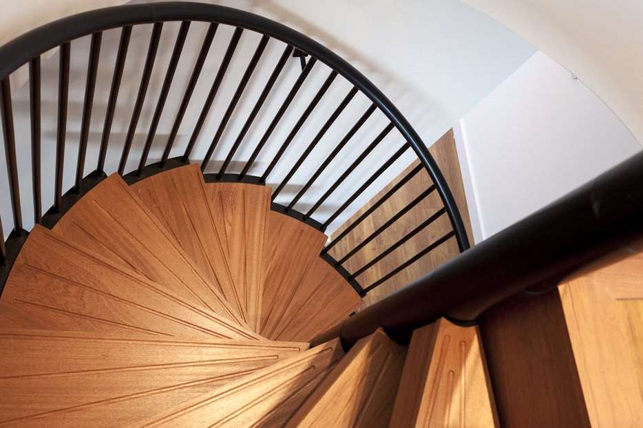 A spiral staircase is featured in the property