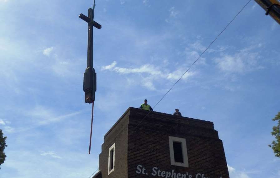 The cross being removed.