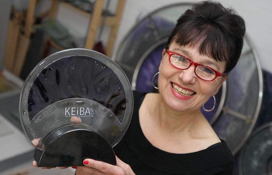 Designer Annie Ross from Maidstone shows off this year's KEiBA trophy