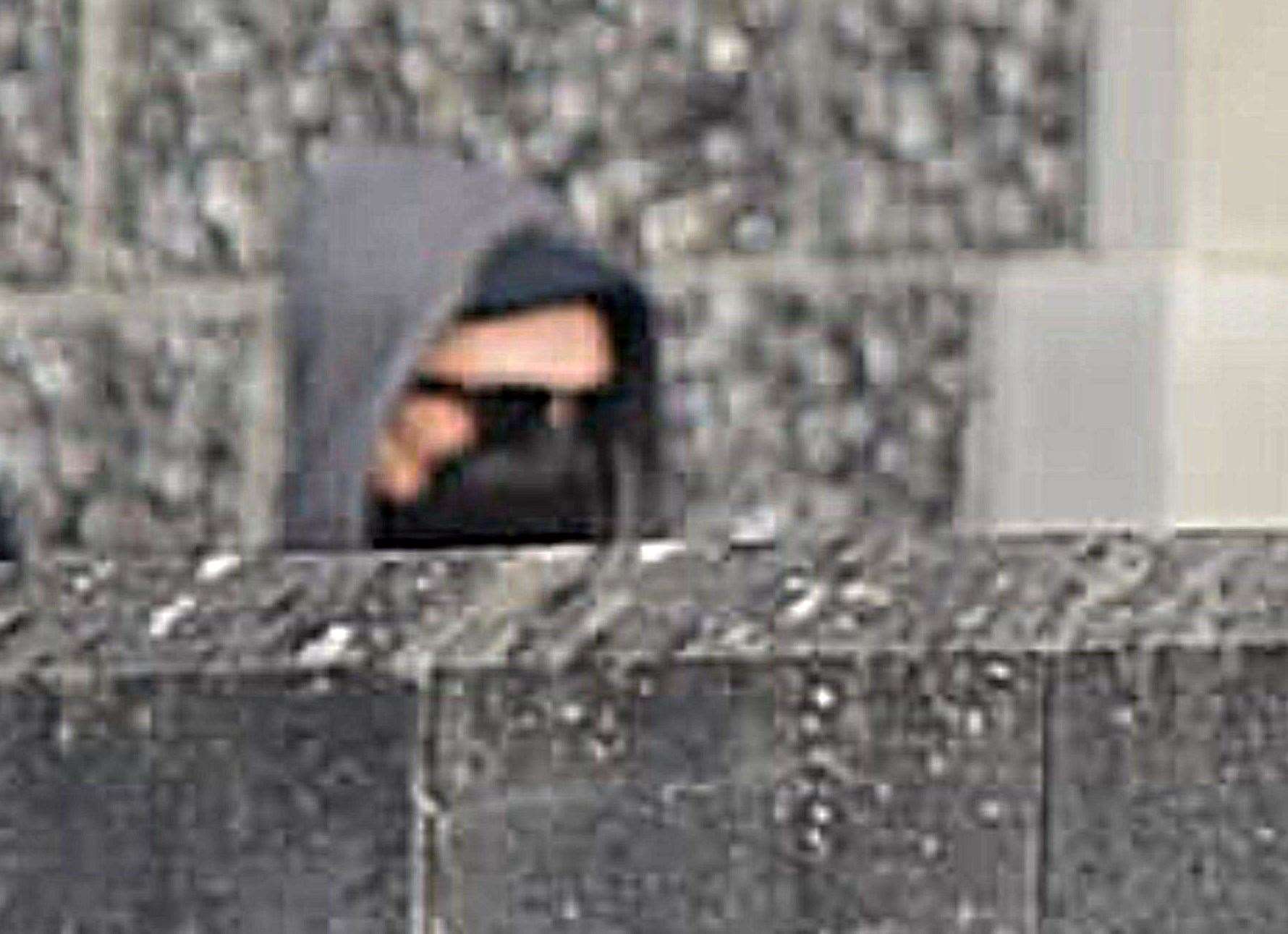 Phillip Henry leaving Canterbury Crown Court in February wearing sunglasses and with his face covered