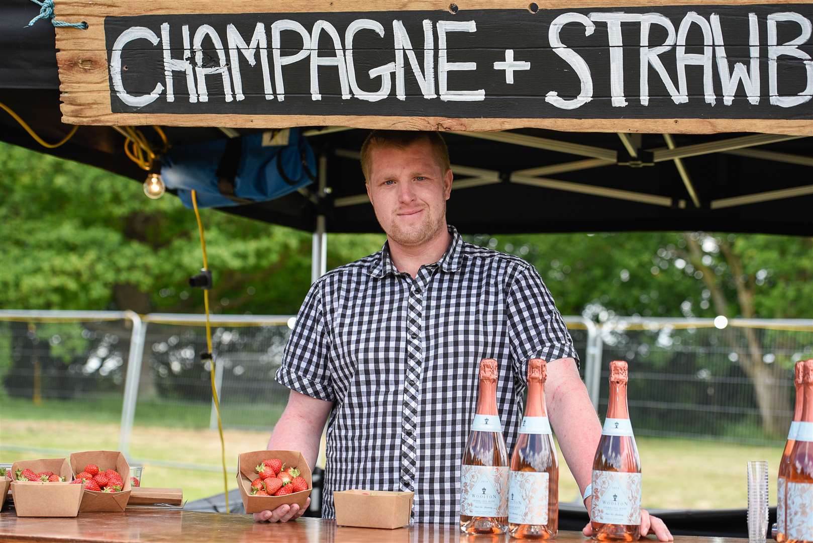 Sam Boyce with strawberries and Champagne from Woolton Farm at Blues on the Farm in 2018