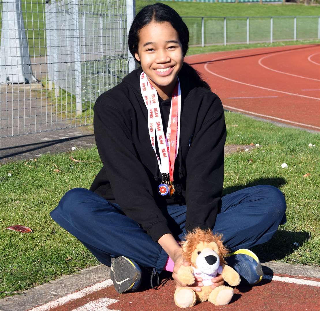 Ukpai, 13, with her medals and England Athletics mascot Leonard The Lion. Picture: Barry Goodwin