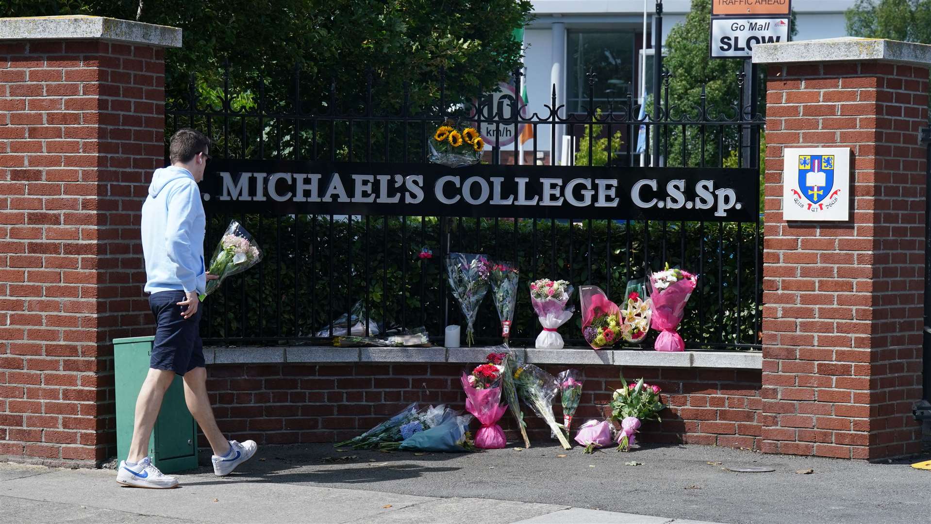 Flowers outside St Michael’s College in Dublin (Niall Carson/PA)