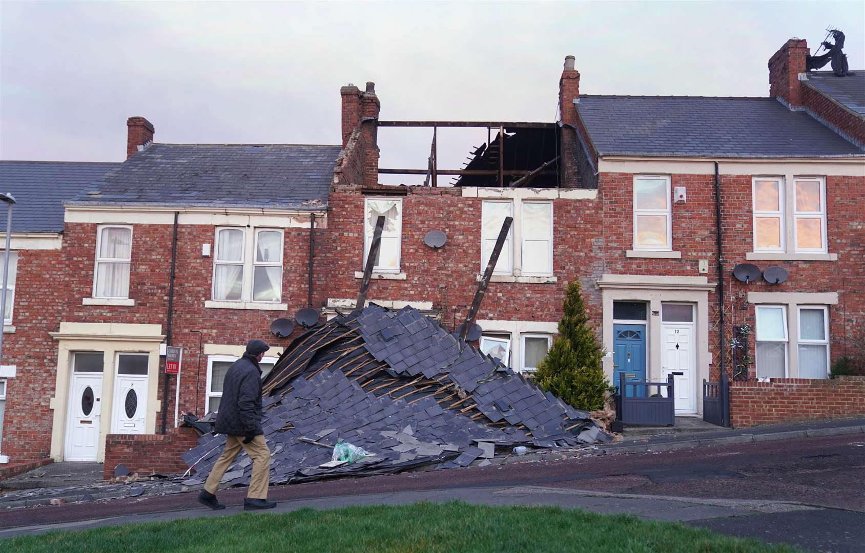 A house on Overhill terrace in Bensham, Gateshead, which lost its roof during Storm Malik (Owen Humphreys/PA)