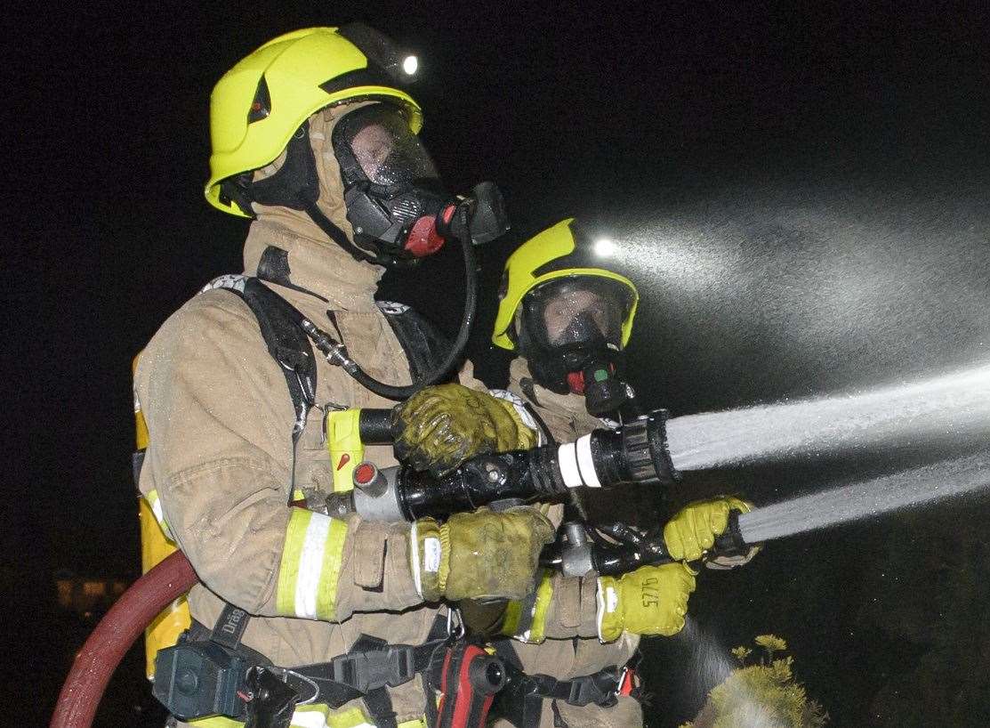 Firefighters wearing breathing apparatus battled the flames. Stock picture