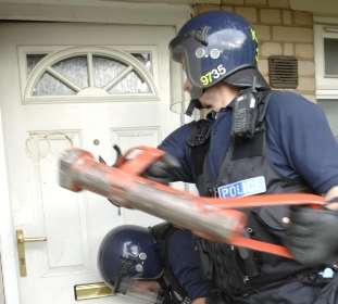 Police raid a suspected "crackhouse"