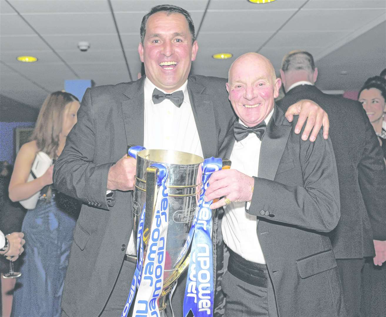 Malcolm Stedman with League 2 title-winning boss Martin Allen and the championship trophy Picture: Barry Goodwin