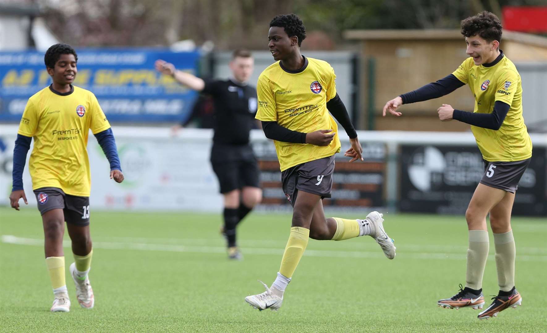 Prince Esanga (middle) celebrates one of his four goals for Danson Sports Yellow. Picture: PSP Images