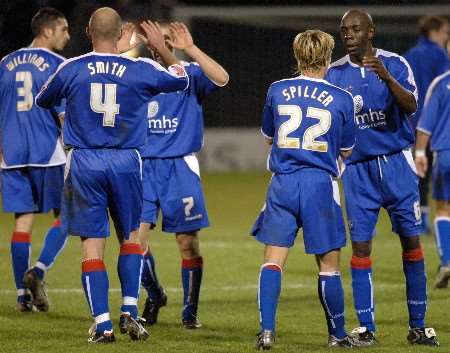 Gillingham's players celebrate a crucial victory at the final whistle. Picture: GRANT FALVEY