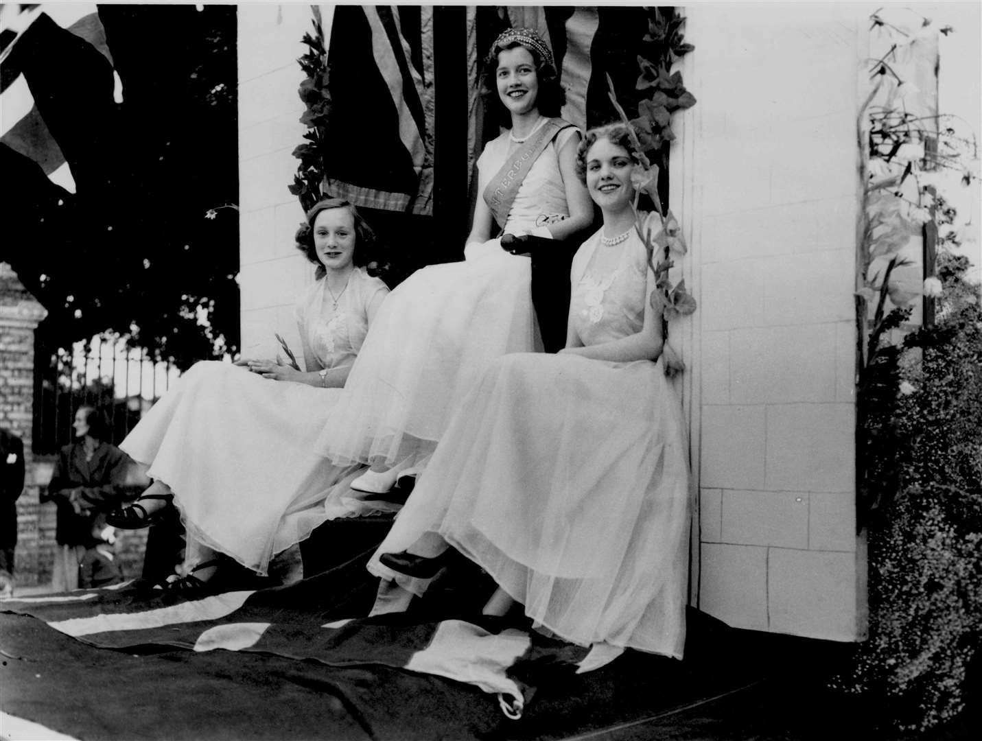 Miss Canterbury, 17-year-old Pauline Groombridge, on her carnival float in August 1954 with Maids of Honour Barbara Farrow, 16, and Shirley Mears, 16