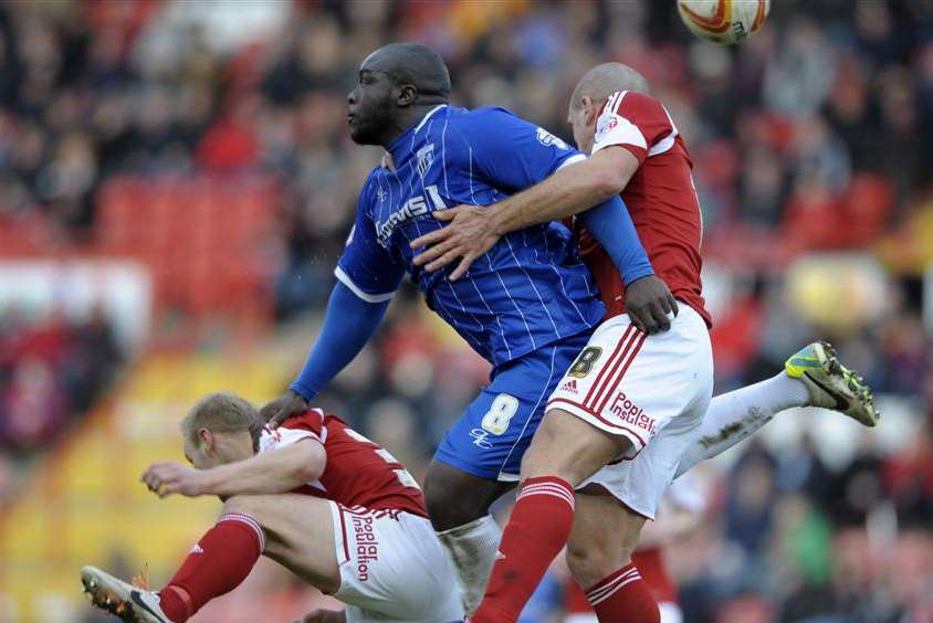 Adebayo Akinfenwa shows his aerial strength against Bristol City. Picture: Barry Goodwin
