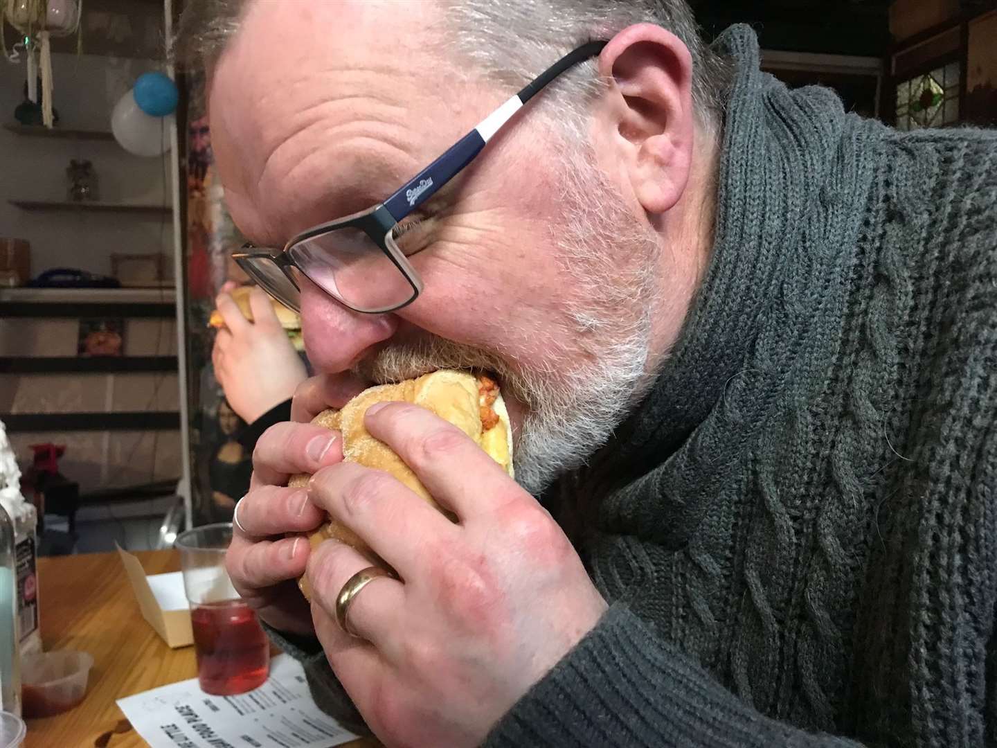 The obligatory picture of your reviewer chomping down on his burger