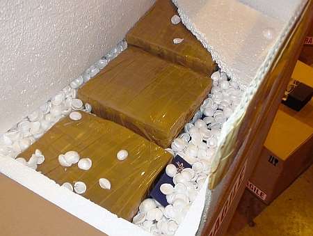 Boxes of suspected heroin among a haul of 80 kilos of the drug, with a street value of £3.6million, found at a house in Dartford by officers from the Serious Organised Crime Agency.
