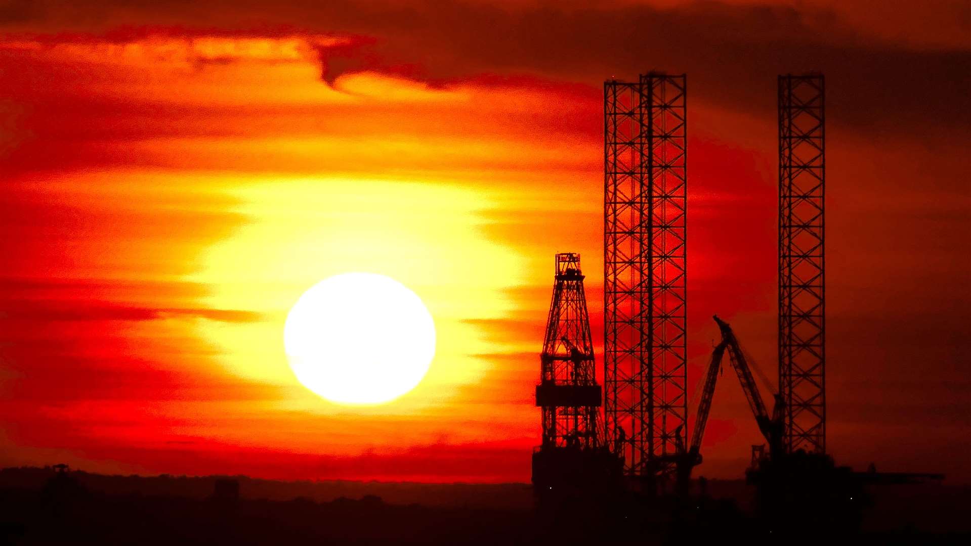 Sun sets behind the Prospector 1 oil-drilling rig now moored at Sheerness Docks on the Isle of Sheppey. Picture: Barry Hollis
