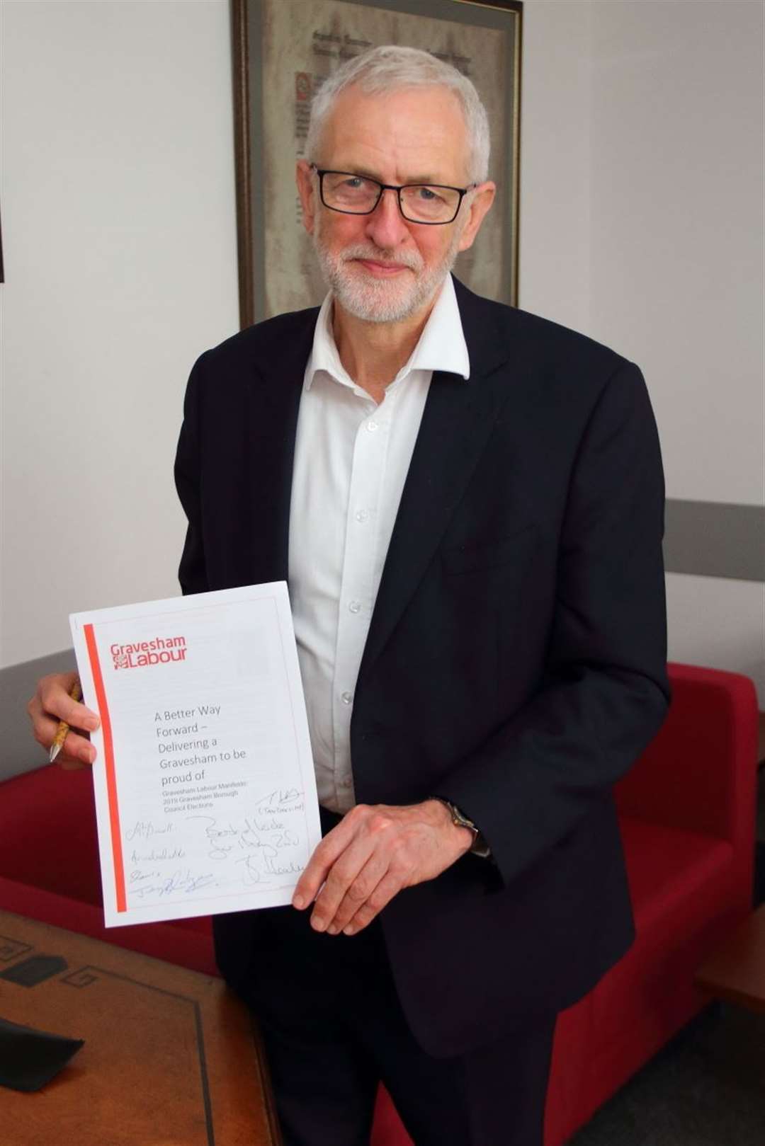 Jeremy Corbyn with a copy of the Gravesham Labour group's manifesto, which he signed