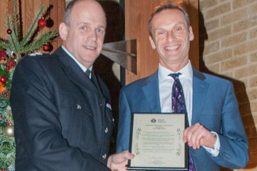 Phillip Mind receives his award from Chief Spt Jon Sutton