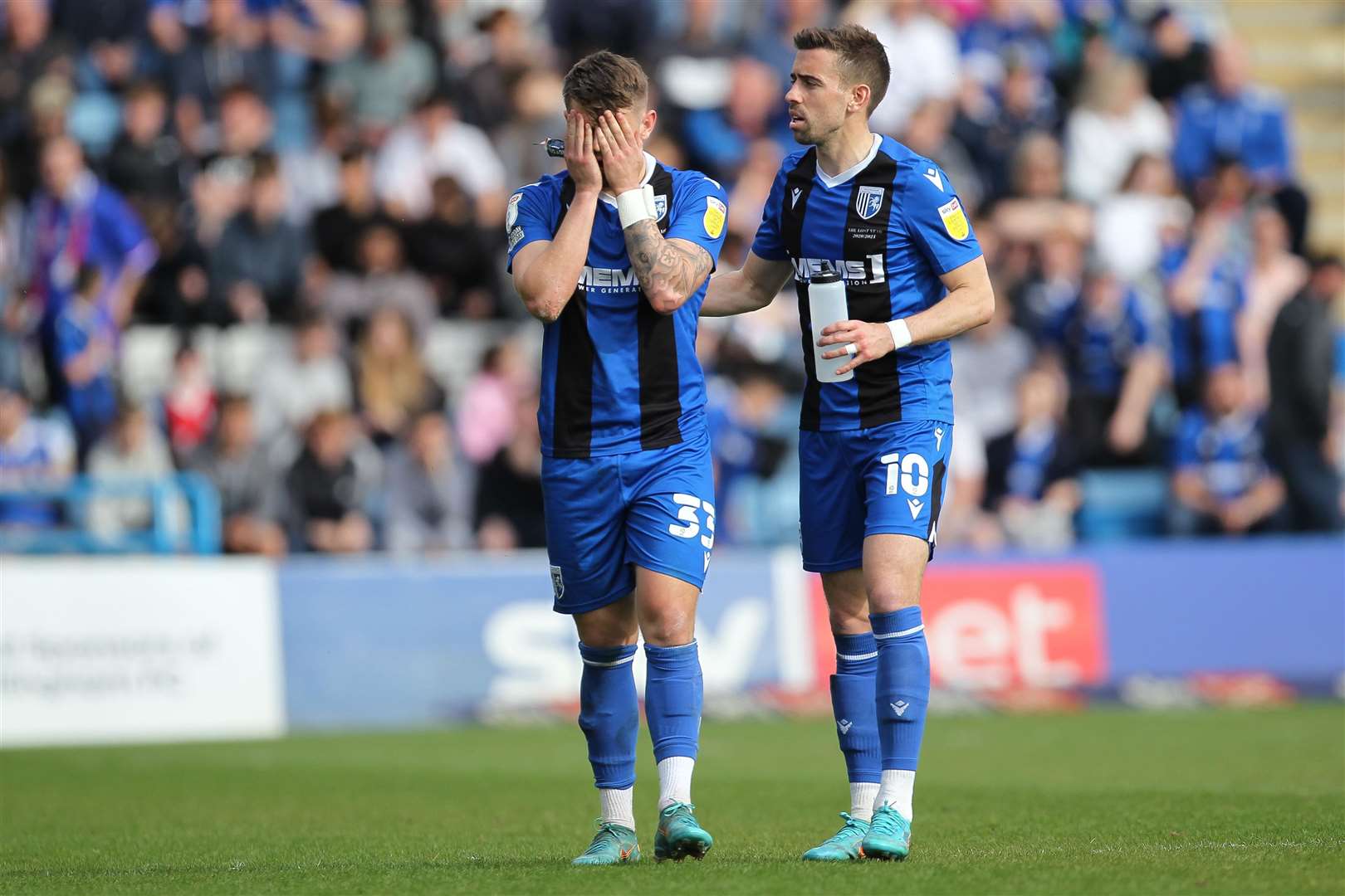 Charlie Kelman is sent off and is consoled by teammate Olly Lee Picture: KPI