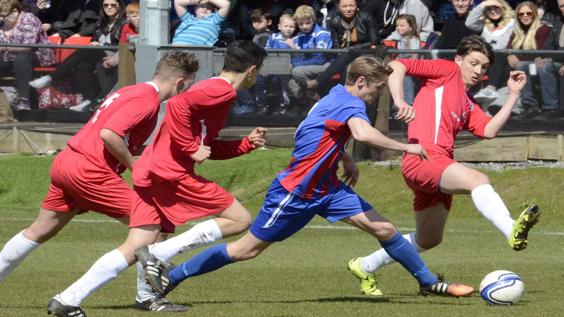 Oak Athletic (stripes) and Bredhurst Juniors fight it out in the Under-18 John Leeds Trophy final Picture: Chris Davey