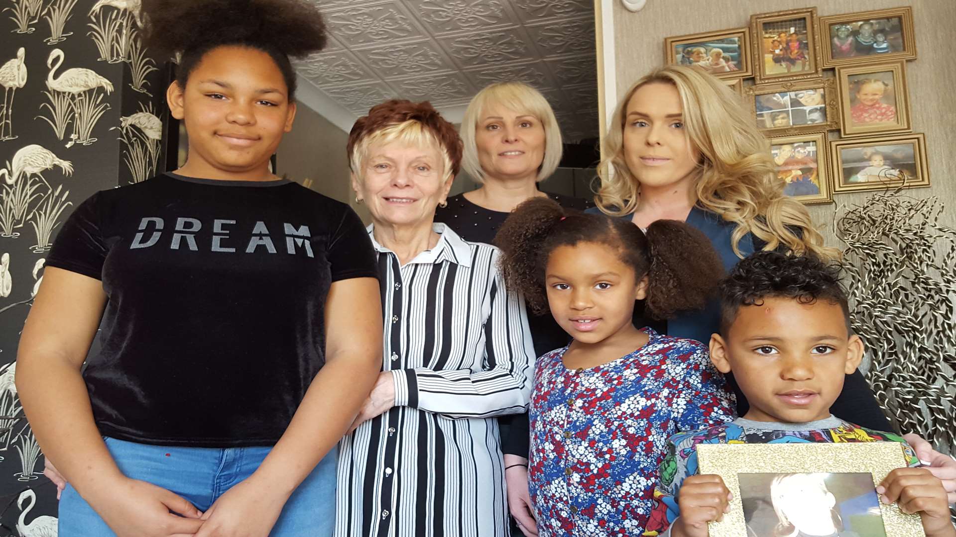 Sian's daughter Eden Hollands, 11, gran Christine Smith, mum Nicola Smith, daughter Marne Hollands, seven, sister Ebony Hollands, and son Roman Hollands, four, holding a picture of Sian
