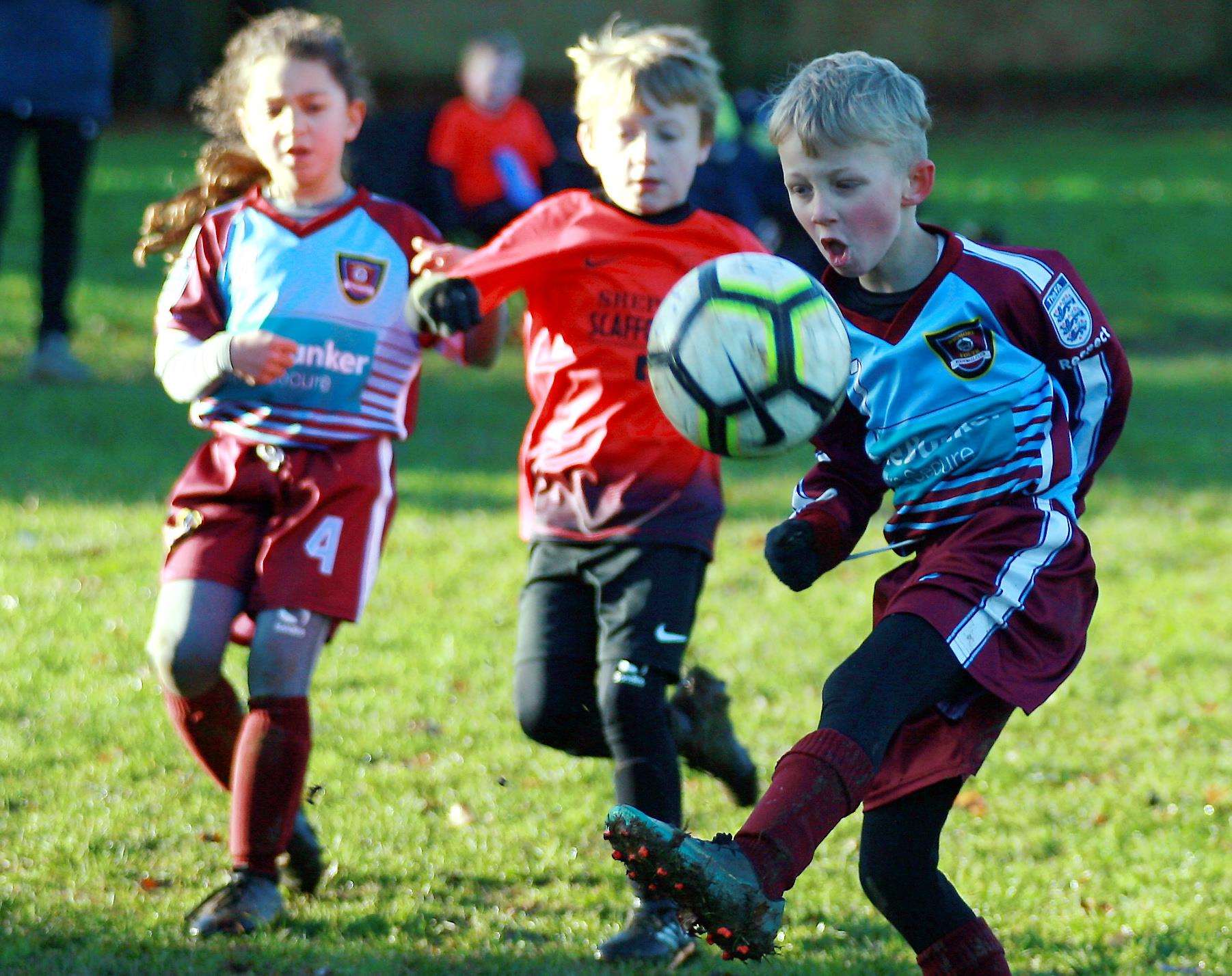 Wigmore Youth Wanderers under-8s (claret) go head-to-head with Sheerness East Youth Picture: Phil Lee