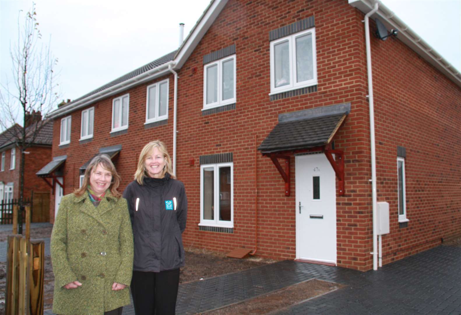Cllr Sue Chandler, Dover District Council Cabinet Member for Housing with Verity Johnson, Housing Services Manager for East Kent Housing outside the new homes.