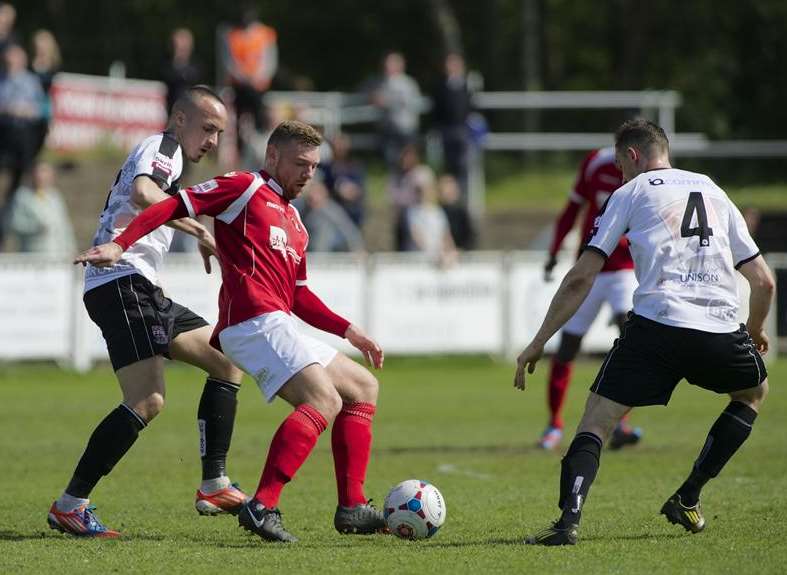 Billy Bricknell takes on two Bromley players Picture: Andy Payton