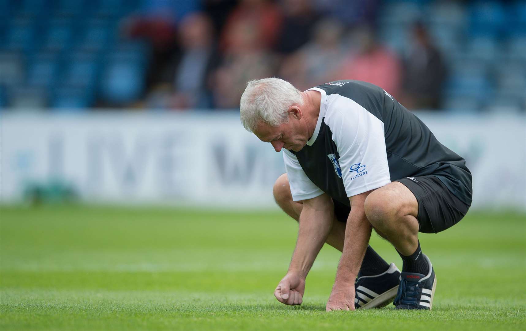 Head groundsman John Plummer repairs the Priestfield pitch Picture: Ady Kerry