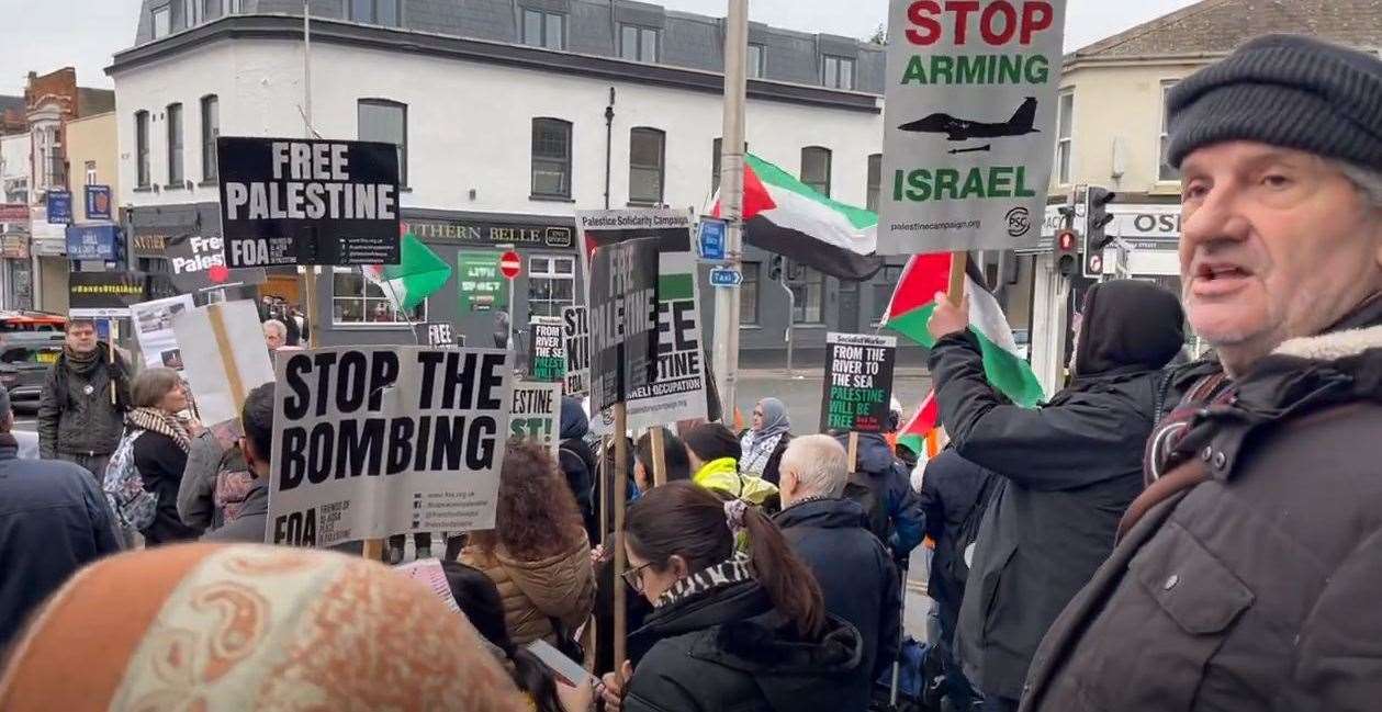 Placards being waved in support of the Palestinian civilians