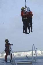 SAFE AND SOUND: Suffolk firefighters being winched aboard