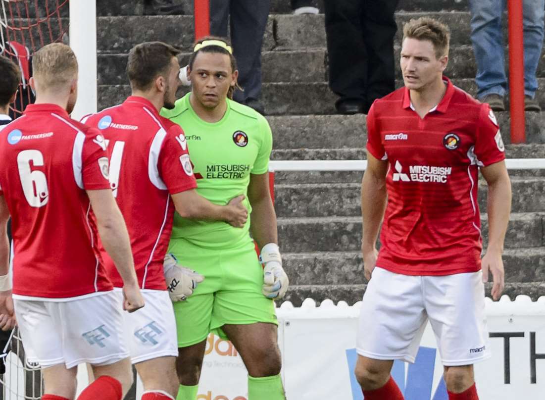 Ebbsfleet goalkeeper Nathan Ashmore congratulated by team-mates after saving Marvin Morgan's penalty. Picture: Andy Payton