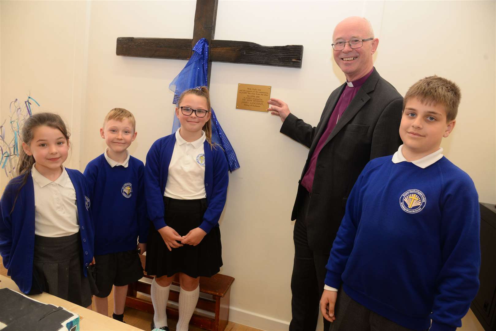 Pupils with Bishop James of Rochester at the opening of St James Church of England Primary Academy after it was ravaged by fire on Friday afternoon. Picture: Chris Davey