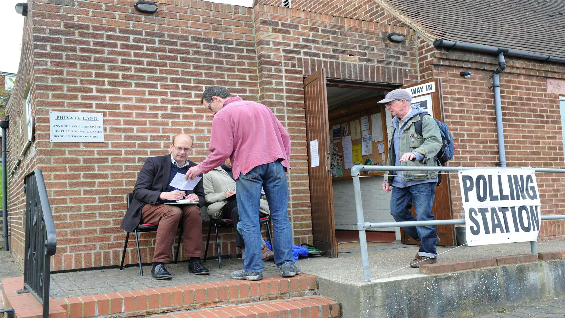 People attend Borstal Village Hall to cast their vote