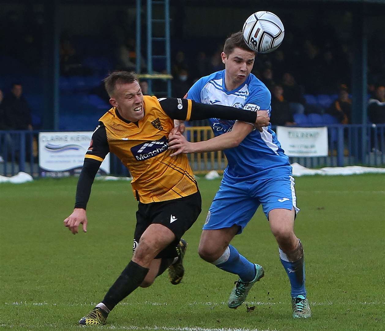 Tonbridge substitute Jake Embery, right, and Maidstone midfielder Sam Corne battle for the ball Picture: Dave Couldridge