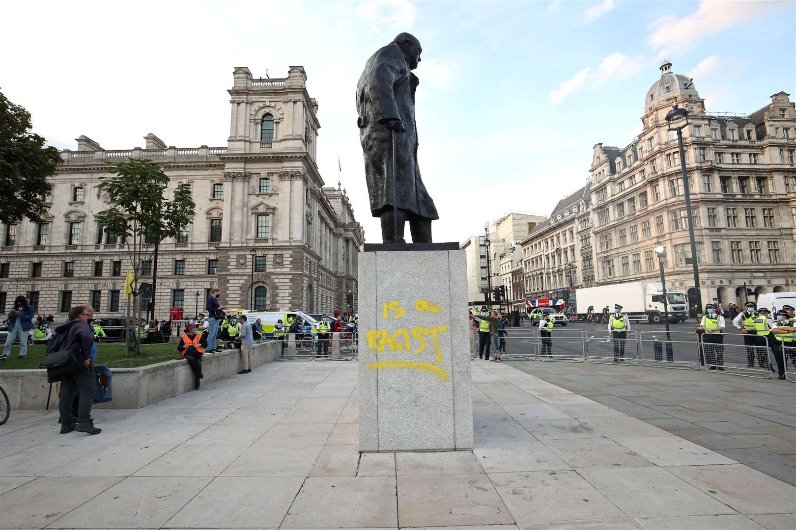 Police in a cordon around the statue of Winston Churchill, after it was vandalised (Jonathan Brady/PA)