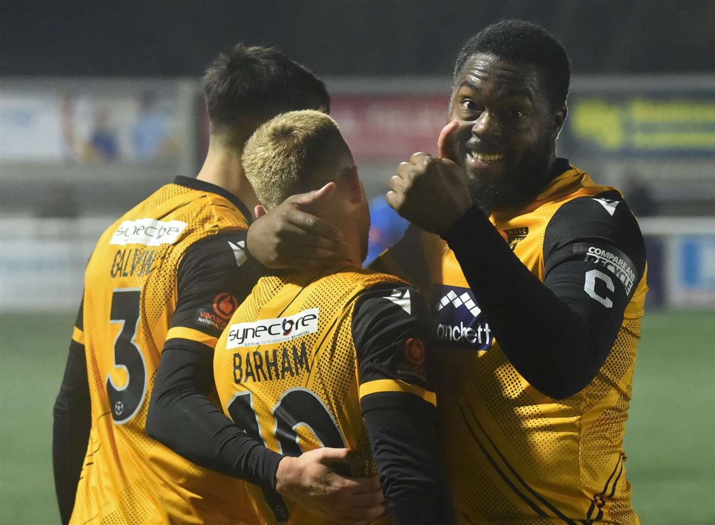Jack Barham, centre, celebrates with opening goalscorer Ryan Galvin and skipper Jerome Binnom-Williams after scoring Maidstone's late clincher. Picture: Steve Terrell