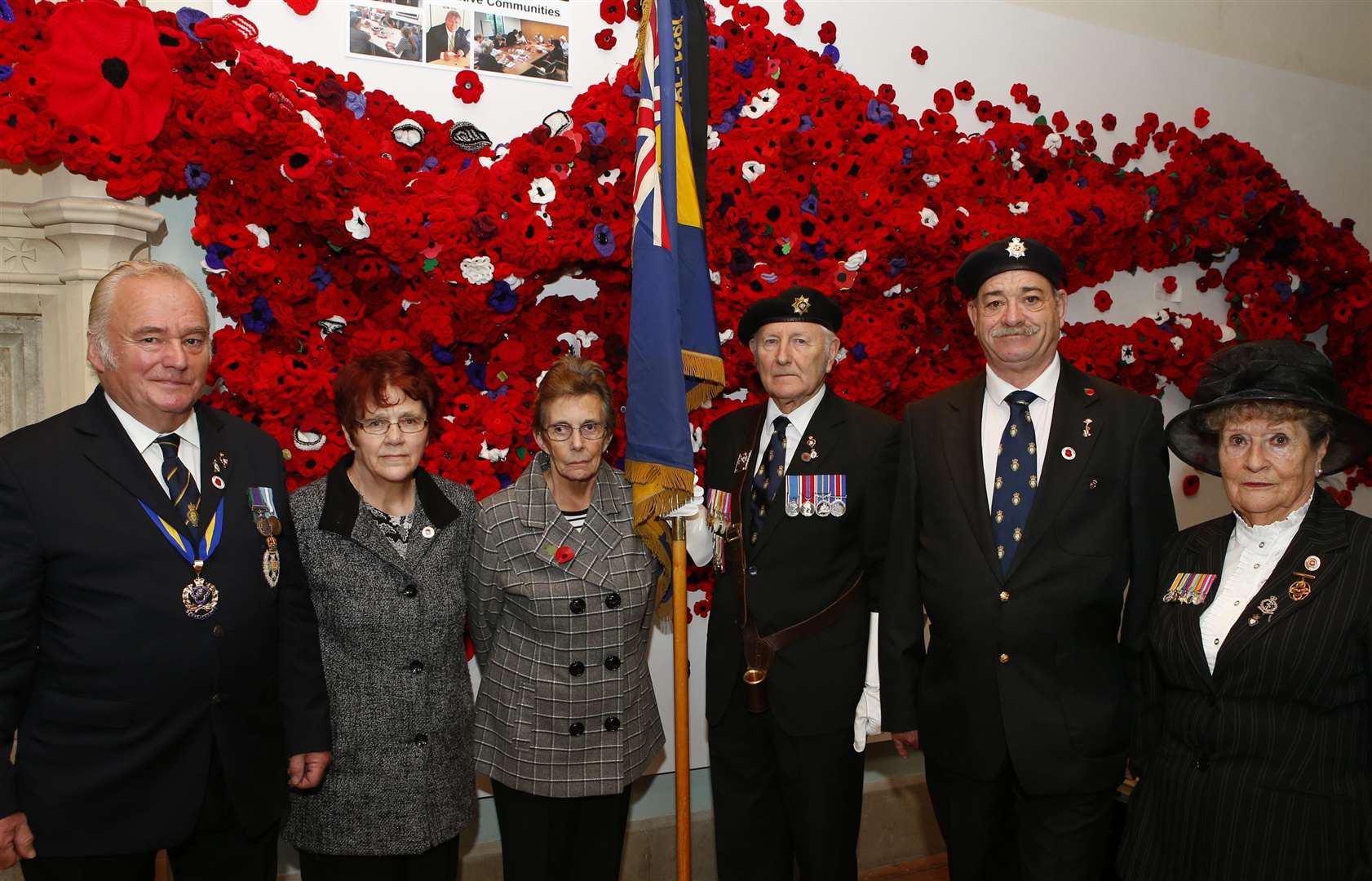 Members of the Maidstone Royal British Legion at a display of 5,000 poppies at Maidstone Museum in St Faith's Street Picture: Andy Jones